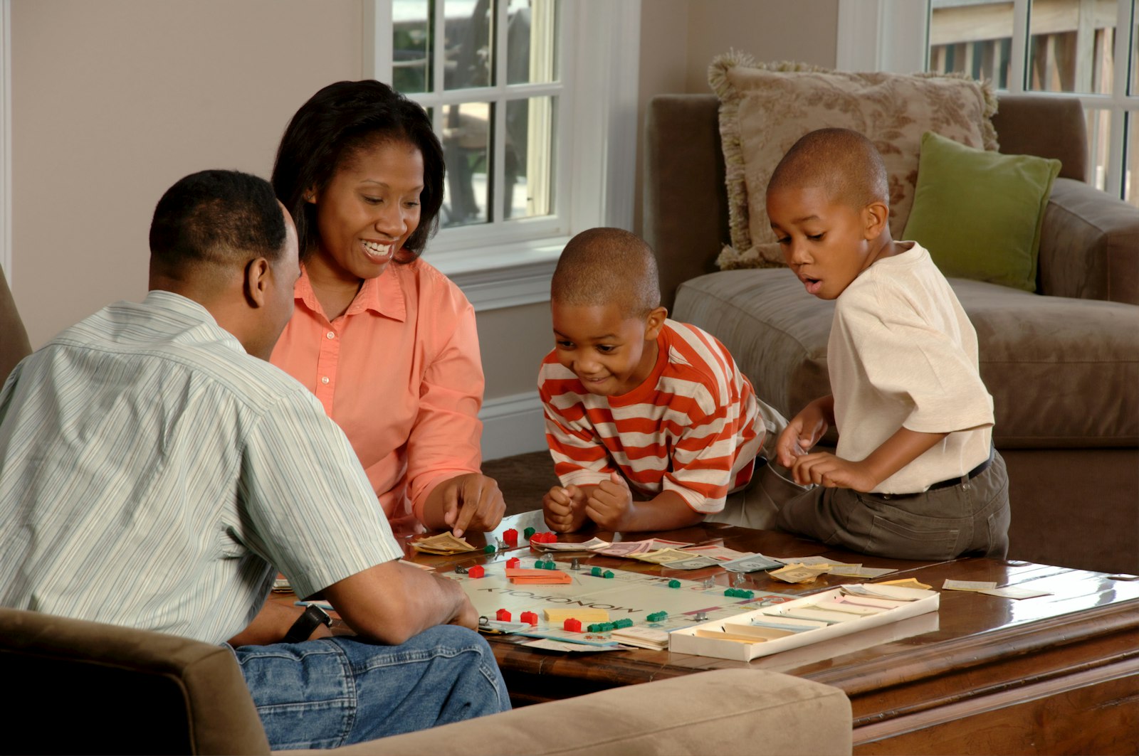 Family playing a board game together at home